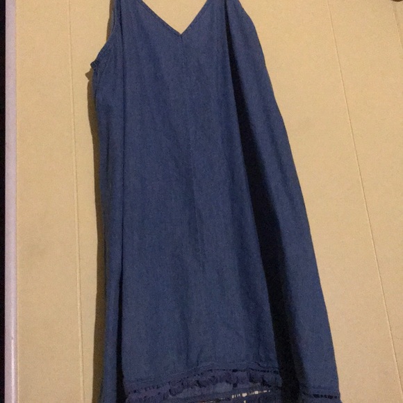 A denim dress with a design on the bottom - Picture 2 of 4